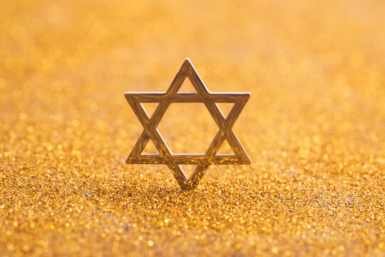 Jewish star of david on golden background