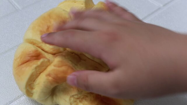 Close Up of Hand Compressing Squishy Stress Relief Toy