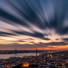 Fototapeta premium Dramatic Sunset Sky Over Illuminated City and Suspension Bridge by River