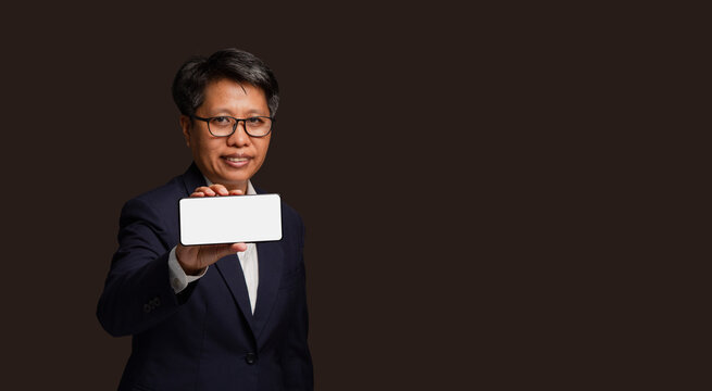 Businesswoman showing blank smartphone screen
