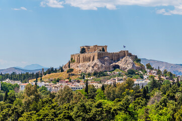 Fototapeta premium A view from the Panathenaic Stadium towards the Acropolis in Athens, Greece in early summertime