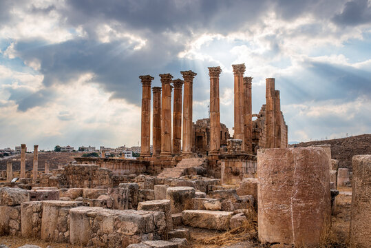 Temple of Artemis in Jerash with sun rays through clouds, Jordan