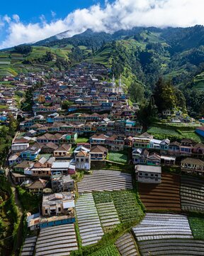 Majestic view of Dusun Butuh, famously known as Nepal van Java, a colorful hillside village nestled on the steep slopes of Mount Sumbing, Indonesia.
