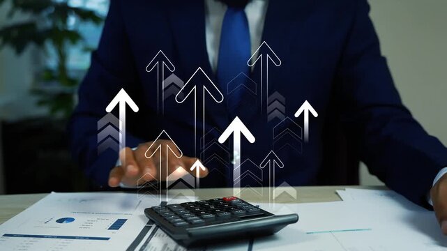 Holographic growing arrow up animation on the screen with businessman using a calculator, Man hand using a calculator with hologram arrow animation