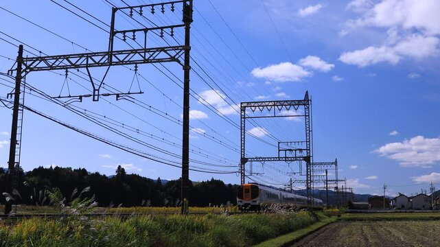 Short 4K Clip of Kintetsu Railway Six‑Car Express Train Passing Through Countryside &ndash; No Audio (6 Seconds)