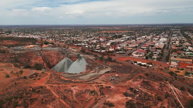 Aerial Drone View of Kalgoorlie Boulder, Western Australia, Historic Mining City Under Overcast Sky, Industrial Landscape, Cinematic 4K Footage