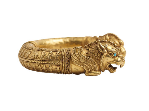 Ancient persian gold bracelet featuring intricate mythological winged lion engravings and detailed feline head terminals crafted with historical elegance isolated on a pure white background for high q
