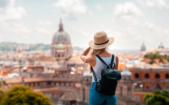 ome Europe Italia travel summer tourism holiday vacation background -young smiling girl with mobile phone camera and map in hand standing on the hill looking on the cathedral Vatican