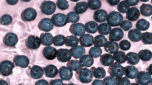 Refreshing summer food background with blueberries in water