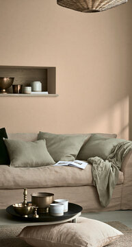 Cozy Minimalist Living Room with Neutral Tones and Soft Textured Couch in Natural Light