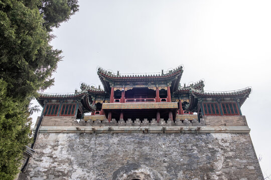 Traditional Chinese pavilion over stone wall at Summer Palace in Beijing China spring