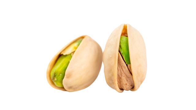 Two organic roasted salted pistachio nuts in shell isolated on a transparent background