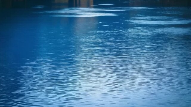Cinematic parallax shot layering clear water ripples foreground with radiant midground reflection