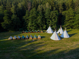 Summer camp teepees and tents in Manetin forest meadow © Richard Semik