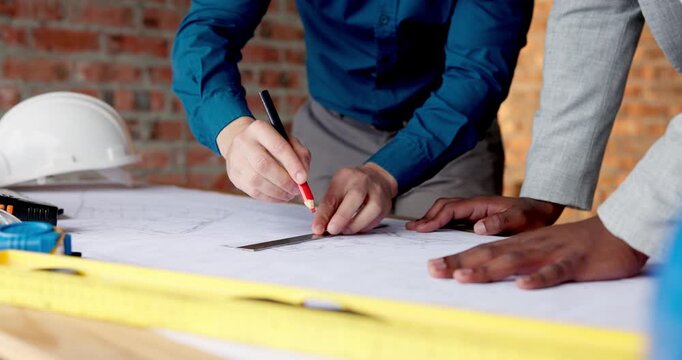 Architect, drawing and hands with floor plan in building, teamwork or ideas for property development. Blueprint, design and people with paperwork for renovation, collaboration and civil engineering