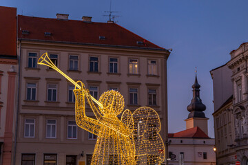 Obraz premium Illuminated angel playing trumpet celebrating Christmas in Znojmo