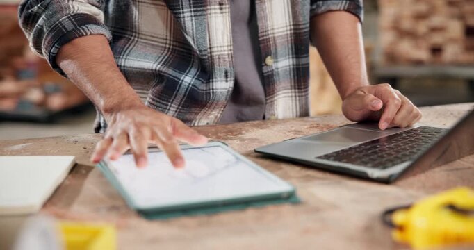 Laptop, tablet and hands with man in workshop for woodworking inventory, technology and artisan. Furniture checklist, quality assurance and online report with person typing in factory for production