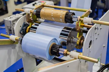 Plastic bag manufacturing machine  Automatic polyethylene plastic bag production machine roller of the plastic bag production machine  product packaging concept © Photo Gallery