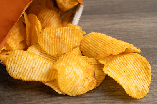 Potato chips , delicious BBQ seasoning spicy for crips, thin slice deep fried snack fast food.