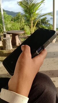 video Woman Hand Scrolling Smartphone Screen with Mobile App and Social Media Concept