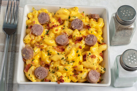 mac and cheese  top with sausages  and herbs