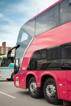 Double-decker intercity coach with a Busscar body on a Volvo 8x2 chassis, parked in an operational passenger transport depot.