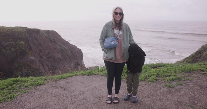 Mother and Young Son Posing for Photo at Spyglass Park Overlooking the Pacific Ocean