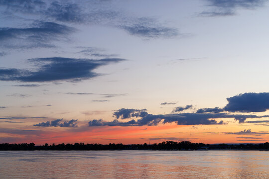Dramatic twilight sky over river horizon