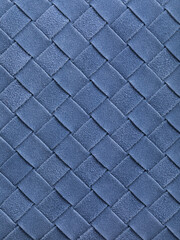Fototapeta premium Woven blue suede leather texture background with diagonal interlaced pattern close-up
