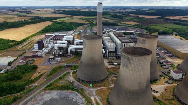 Aerial view of massive power station with hyperbolic cooling towers near Nottingham
