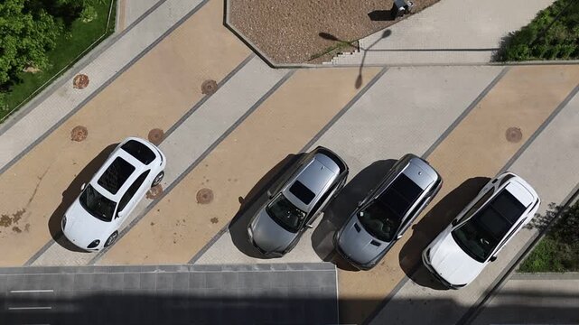 Modern city street with parked cars and careful drivers