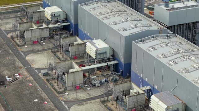 Close up aerial view of gas turbine generation houses and high voltage electrical switchgear at a power station near Gainsborough, UK.