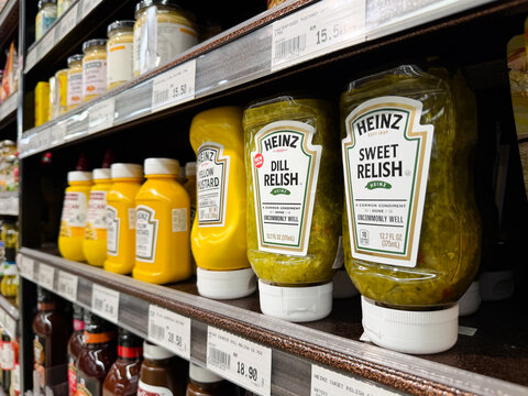 PENANG, MALAYSIA - MAY 29, 2026: Heinz mustard and relish condiments displayed on supermarket grocery shelf.