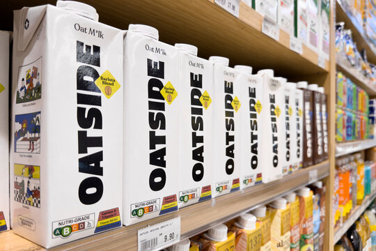 PENANG, MALAYSIA - JUL 03, 2026: Oatside oat milk cartons displayed on supermarket retail shelf.