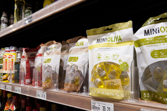 PENANG, MALAYSIA - JUL 06, 2026: Mini Oliva olive oil capsules displayed on supermarket grocery shelf.