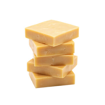 A vertical stack of five square blocks of light brown caramel fudge candy isolated on a white background, for food concepts