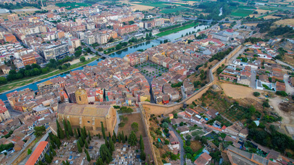 Fototapeta premium Aerial view of the downtown above the city and Balaguer in Spain, on a sunny spring afternoon.