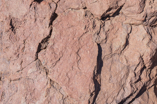Ancient lava rock formations with distinctive geological layers in Tenerife's volcanic landscape.