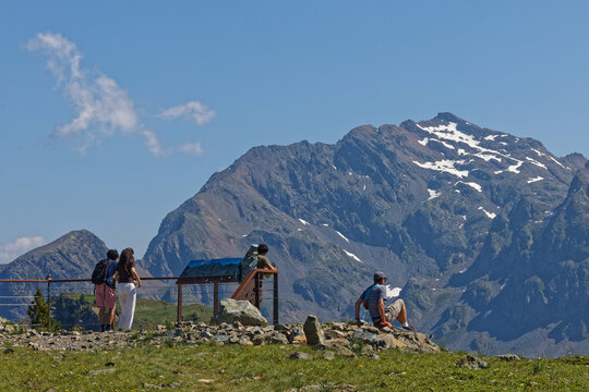 CHAMROUSSE, FRANCE, June, 27, 2026 : Tourists admire lthe mountain landscape at the Belvedere of Croix de Chamrousse