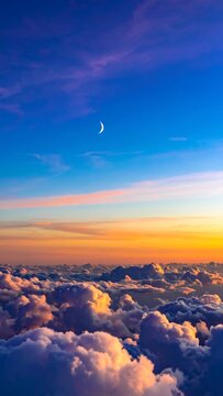 Sunset Over Clouds with Moon.