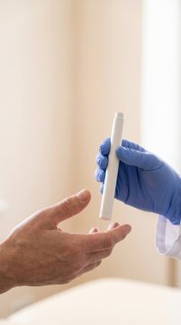 Healthcare Professional Handing Generic Medical Device to Patient During Medical Consultation