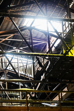 metal frames under roof of abandoned factory