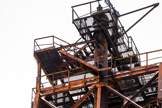 steel structures of plant tower during snowfall