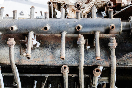 broken rusty pipe device in abandoned workshop