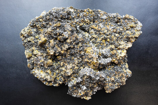 raw sphalerite, pyrite, chalcopyrite rock on black