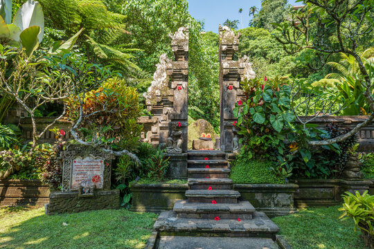 Traditional Balinese gate in tropical garden in Ubud, Bali