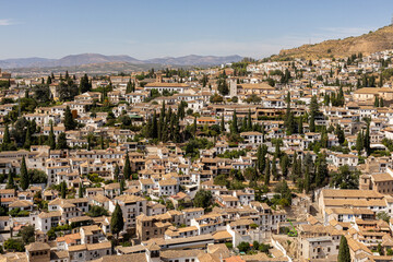 Obraz premium August, 19, 2025 Malaga, Spain. Panoramic aerial-style view of Granada city. Urban landscape. Summer time.