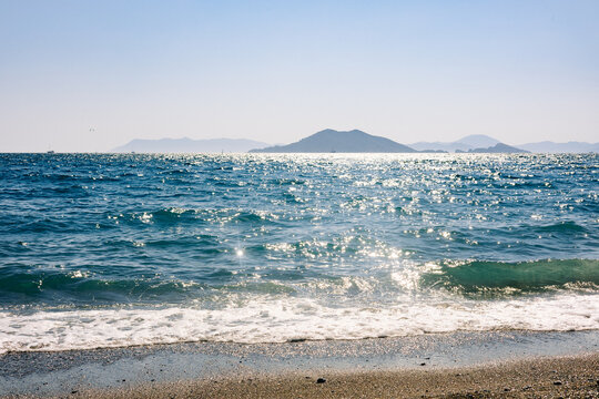 Calis beach seascape with sun glares in Fethiye Turkey.