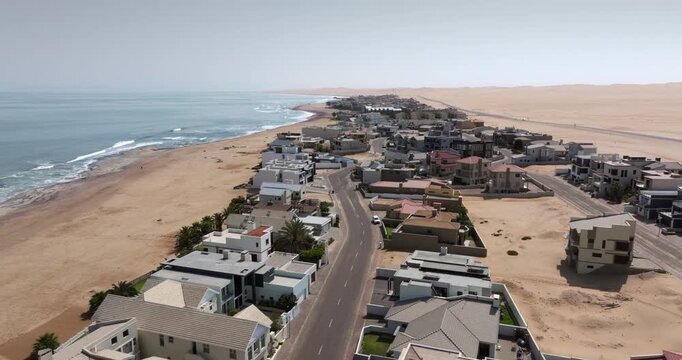 Aerial jib shot of Langstrand, a beach resort town between Swakopmund and Walvis Bay in the Namib Desert, Namibia.
