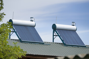 Solar Water Heaters Installed on Residential Roof © Serghei V